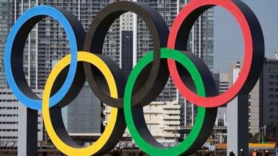 FILE - In this Dec. 1, 2020, file photo, the Olympic Symbol is reinstalled after it was taken down for maintenance ahead of the postponed Tokyo 2020 Olympics in the Odaiba section in Tokyo. More than 80% of people in Japan who were surveyed in two polls in the last few days say the Tokyo Olympics should be canceled or postponed, or say they believe the Olympics will not take place. (AP Photo/Eugene Hoshiko, File)(AP) FILE - In this Dec. 1, 2020, file photo, the Olympic Symbol is reinstalled after it was taken down for maintenance ahead of the postponed Tokyo 2020 Olympics in the Odaiba section in Tokyo. More than 80% of people in Japan who were surveyed in two polls in the last few days say the Tokyo Olympics should be canceled or postponed, or say they believe the Olympics will not take place. (AP Photo/Eugene Hoshiko, File)(AP)