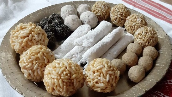 A plate of 'larus' and 'pithas' which are traditional Assamese sweets prepared for Magh Bihu. (HT PHOTO).