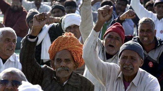 Farmers raise slogans during the ongoing protest against the new farm laws at Haryana-Rajasthan border. (HT Photo) Farmers raise slogans during the ongoing protest against the new farm laws at Haryana-Rajasthan border. (HT Photo)