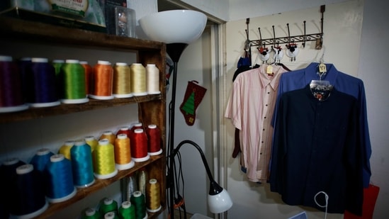 Shirts of people who died from COVID-19 hang in Erendira Guerrero’s home workshop in Ciudad Juarez on January 11. “Due to COVID-19, many people were left without closure, because they couldn’t say goodbye to their family members,” Guerrero told AP. “They need to close the circle. The bears are helping them.” (Christian Chavez / AP) Shirts of people who died from COVID-19 hang in Erendira Guerrero’s home workshop in Ciudad Juarez on January 11. “Due to COVID-19, many people were left without closure, because they couldn’t say goodbye to their family members,” Guerrero told AP. “They need to close the circle. The bears are helping them.” (Christian Chavez / AP)