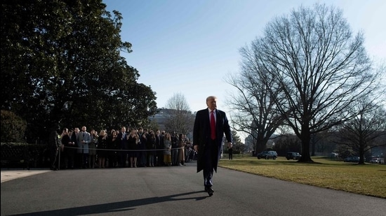 US President Donald Trump walks to speak to the press before walking to Marine One on the South Lawn of the White House on January 12. (AFP)