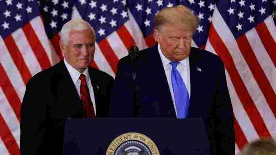 US President Donald Trump and Vice President Mike Pence stand while making remarks about early results from the 2020 US presidential election. US President Donald Trump and Vice President Mike Pence stand while making remarks about early results from the 2020 US presidential election.