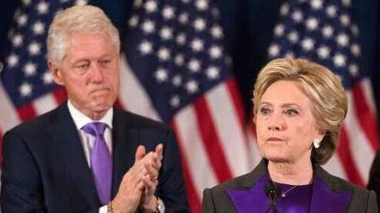 Former President Bill Clinton applauds as his wife, Democratic presidential candidate Hillary Clinton speaks in New York, Wednesday, Nov. 9, 2016, where she conceded her defeat to Republican Donald Trump after the hard-fought presidential election. President Trump and his allies are harking back to his own transition four years ago to make a false argument that his own presidency was denied a fair chance for a clean launch. Press secretary Kayleigh McEnany laid out the case from the White House podium last week and the same idea has been floated by Trump's personal lawyer and his former director of national intelligence. The day after her defeat in 2016, Hillary Clinton conceded. (AP Photo/Matt Rourke)(AP)