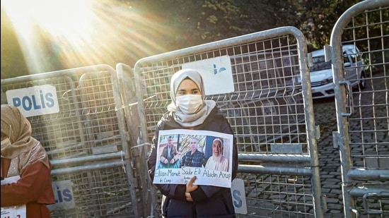 A member of the Muslim Uighur minority holds a placard as she demonstrates in front of the Chinese consulate on December 30, 2020, in Istanbul. (AFP file) A member of the Muslim Uighur minority holds a placard as she demonstrates in front of the Chinese consulate on December 30, 2020, in Istanbul. (AFP file)