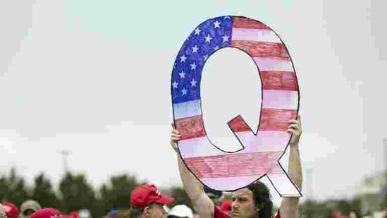 The QAnon conspiracy theory is centered on the baseless belief that Trump is waging a secret campaign against “deep state” enemies and a child sex trafficking ring run by satanic pedophiles and cannibals.(AP) The QAnon conspiracy theory is centered on the baseless belief that Trump is waging a secret campaign against “deep state” enemies and a child sex trafficking ring run by satanic pedophiles and cannibals.(AP)