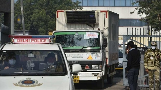 A truck carrying the first consignment of Covid-19 vaccines leaves from Delhi Airport for the Rajiv Gandhi Super Specialty Hospital, in New Delhi. (Sanjeev Verma/HT PHOTO). A truck carrying the first consignment of Covid-19 vaccines leaves from Delhi Airport for the Rajiv Gandhi Super Specialty Hospital, in New Delhi. (Sanjeev Verma/HT PHOTO).