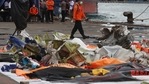 An Indonesian rescue team member walks near debris found in the waters around the location where a Sriwijaya Air passenger jet crashed, at the search and rescue command center at Tanjung Priok Port in Jakarta, Indonesia, Indonesia, (AP) An Indonesian rescue team member walks near debris found in the waters around the location where a Sriwijaya Air passenger jet crashed, at the search and rescue command center at Tanjung Priok Port in Jakarta, Indonesia, Indonesia, (AP)