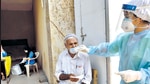 A BMC healthcare worker collects the swab sample of a resident at Govandi on Tuesday. (Satish Bate/HT Photo) A BMC healthcare worker collects the swab sample of a resident at Govandi on Tuesday. (Satish Bate/HT Photo)