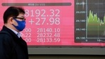 A man walks by an electronic stock board of a securities firm in Tokyo, Wednesday, Jan. 13, 2021. Asian stock markets were mixed Wednesday after Wall Street rebounded, shrugging off uncertainty about a possible new attempt to impeach President Donald Trump over last week's attack on the U.S. Capitol. (AP Photo/Koji Sasahara)(AP) A man walks by an electronic stock board of a securities firm in Tokyo, Wednesday, Jan. 13, 2021. Asian stock markets were mixed Wednesday after Wall Street rebounded, shrugging off uncertainty about a possible new attempt to impeach President Donald Trump over last week's attack on the U.S. Capitol. (AP Photo/Koji Sasahara)(AP)