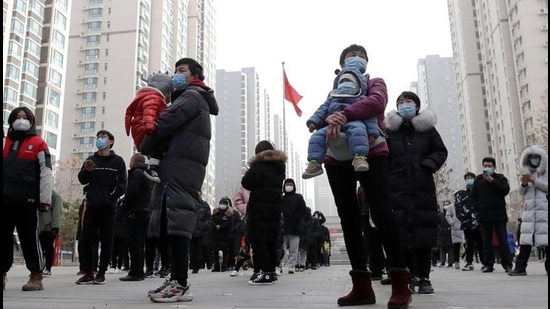 People practise social distancing as they line up for a second round of citywide nucleic acid testing at a residential compound, following new cases of the coronavirus disease in Shijiazhuang, Hebei province on January 12. (REUTERS) People practise social distancing as they line up for a second round of citywide nucleic acid testing at a residential compound, following new cases of the coronavirus disease in Shijiazhuang, Hebei province on January 12. (REUTERS)