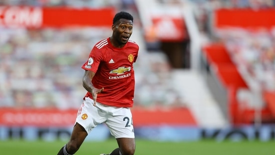 FILE PHOTO: Soccer Football - Premier League - Manchester United v Crystal Palace - Old Trafford, Manchester, Britain - September 19, 2020 Manchester United's Timothy Fosu-Mensah in action Pool via REUTERS/Richard Heathcote EDITORIAL USE ONLY. No use with unauthorized audio, video, data, fixture lists, club/league logos or 'live' services. Online in-match use limited to 75 images, no video emulation. No use in betting, games or single club/league/player publications.  Please contact your account representative for further details./File Photo (Pool via REUTERS)