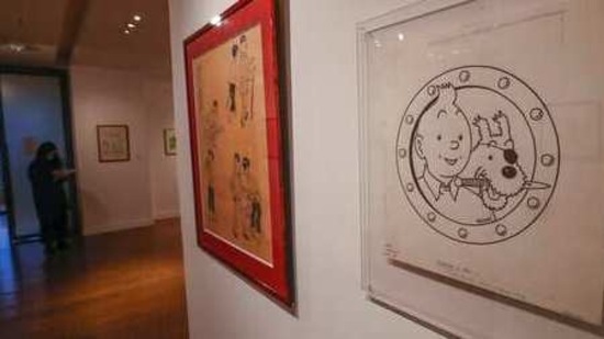 The Chinese inked on paper original of the comic character Tintin and his dog snowy as a pirate made for an advertising and drawn by Belgian creator Herge, is displayed at the Artcurial auction house in Paris. (AP Photo ) The Chinese inked on paper original of the comic character Tintin and his dog snowy as a pirate made for an advertising and drawn by Belgian creator Herge, is displayed at the Artcurial auction house in Paris. (AP Photo )