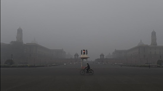 A man rides cycle near the Vijay Chowk, amid a cold and foggy winter morning in New Delhi on January 12. (PTI) A man rides cycle near the Vijay Chowk, amid a cold and foggy winter morning in New Delhi on January 12. (PTI)