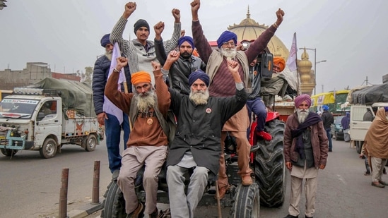 Farmers on their tractor march towards Delhi to join the agitation against the Center's farm laws, in Amritsar Farmers on their tractor march towards Delhi to join the agitation against the Center's farm laws, in Amritsar