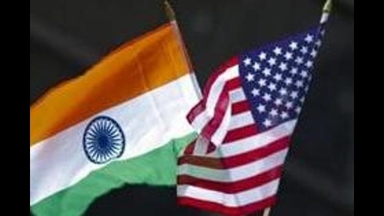 A man holds the flags of India and the US while people take part in the 35th India Day Parade, New York, August 16, 2015 (REUTERS)