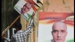 In this file photo taken on July 17, 2019, an Indian man holds a placard depicting Kulbhushan Jadhav. (AFP file) In this file photo taken on July 17, 2019, an Indian man holds a placard depicting Kulbhushan Jadhav. (AFP file)