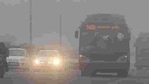 Traffic moves slowly through a dense fog in New Delhi. Cold wave conditions continued across North India claiming 165 lives this winter. AFP PHOTO / Prakash Singh Traffic moves slowly through a dense fog in New Delhi. Cold wave conditions continued across North India claiming 165 lives this winter. AFP PHOTO / Prakash Singh