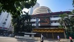 People look at the digital screen on the facade of BSE building in Mumbai.(PTI) People look at the digital screen on the facade of BSE building in Mumbai.(PTI)