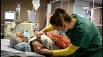 A patient receives the Pfizer-BioNTech Covid-19 vaccine in a private clinic in Aulnay-sous-Bois, France on January 13. (AFP) A patient receives the Pfizer-BioNTech Covid-19 vaccine in a private clinic in Aulnay-sous-Bois, France on January 13. (AFP)