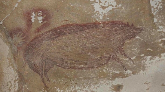 Archaeologists have discovered the world's oldest known cave painting: a life-sized picture of a wild pig that was made at least 45,500 years ago in Indonesia. (Griffith University) Archaeologists have discovered the world's oldest known cave painting: a life-sized picture of a wild pig that was made at least 45,500 years ago in Indonesia. (Griffith University)