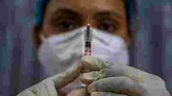 FILE - In this Friday, Jan. 8, 2021, file photo, a health worker checks a syringe before performing a trial run of COVID-19 vaccine delivery system, as India's prepare to kick off the coronavirus vaccination drive on Jan. 16, in Gauhati, India. There has been growing apprehensions among health care workers after India took a regulatory shortcut to approve a vaccine by Indian drugmaker Bharat Biotech before late clinical trials showed it was effective in preventing illness from coronavirus infections. (AP Photo/Anupam Nath, File)(AP) FILE - In this Friday, Jan. 8, 2021, file photo, a health worker checks a syringe before performing a trial run of COVID-19 vaccine delivery system, as India's prepare to kick off the coronavirus vaccination drive on Jan. 16, in Gauhati, India. There has been growing apprehensions among health care workers after India took a regulatory shortcut to approve a vaccine by Indian drugmaker Bharat Biotech before late clinical trials showed it was effective in preventing illness from coronavirus infections. (AP Photo/Anupam Nath, File)(AP)