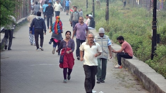 People walk in winter morning at Vadgaon on Sinhgad road in Pune. (HT FILE PHOTO)