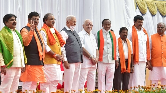 Bengaluru: Karnataka Governor Vajubhai Vala along with Karnataka Chief Minister BS Yediyurappa and newly inducted ministers during the oath-taking ceremony, at Raj Bhavan in Bengaluru, Wednesday, Jan. 13, 2021. (PTI Photo/Shailendra Bhojak)(PTI01_13_2021_000233B)(PTI) Bengaluru: Karnataka Governor Vajubhai Vala along with Karnataka Chief Minister BS Yediyurappa and newly inducted ministers during the oath-taking ceremony, at Raj Bhavan in Bengaluru, Wednesday, Jan. 13, 2021. (PTI Photo/Shailendra Bhojak)(PTI01_13_2021_000233B)(PTI)