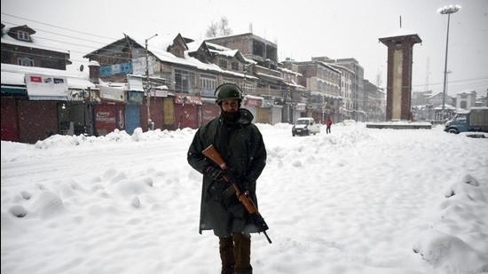CRPF personnel stands guard in front of clock tower at city centre Lalchowk in Srinagar. (ANI) CRPF personnel stands guard in front of clock tower at city centre Lalchowk in Srinagar. (ANI)