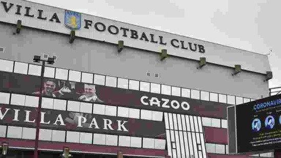FILE - This Saturday, Nov. 21, 2020 file photo shows a general view of a social distancing message on display outside the Villa Park stadium, home of Aston Villa, in Birmingham, England. Aston Villa has on Thursday, Jan. 7, 2021 reported a “significant” coronavirus outbreak and closed its training ground a day before a scheduled FA Cup home game against Liverpool. Villa says “discussions are ongoing between medical representatives of the club, the Football Association and the Premier League.”(AP) FILE - This Saturday, Nov. 21, 2020 file photo shows a general view of a social distancing message on display outside the Villa Park stadium, home of Aston Villa, in Birmingham, England. Aston Villa has on Thursday, Jan. 7, 2021 reported a “significant” coronavirus outbreak and closed its training ground a day before a scheduled FA Cup home game against Liverpool. Villa says “discussions are ongoing between medical representatives of the club, the Football Association and the Premier League.”(AP)