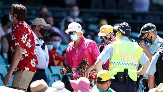 The SCG security escorts a group of six people out of the stadium. (Getty) The SCG security escorts a group of six people out of the stadium. (Getty)
