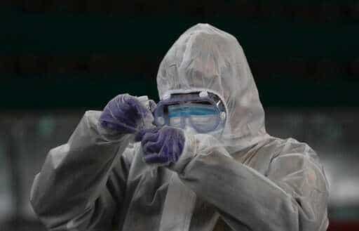 A doctor prepares coronavirus testing for residents. (AP) A doctor prepares coronavirus testing for residents. (AP)