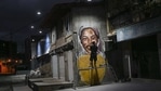 The glowing face of one of Venezuela’s greatest athletes seems to invigorate a corner of the country’s decaying capital, a splash of color and inspiration for increasingly grim times.(AP) The glowing face of one of Venezuela’s greatest athletes seems to invigorate a corner of the country’s decaying capital, a splash of color and inspiration for increasingly grim times.(AP)