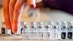 Pharmacist organizes the empty vials of the Pfizer-BioNTech Covid-19 vaccine.(AP) Pharmacist organizes the empty vials of the Pfizer-BioNTech Covid-19 vaccine.(AP)