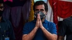 Congress leader Rahul Gandhi gestures as he attends the annual bull taming event "Jallikattu" in the village of Avaniyapuram, on the outskirts of Madurai on January 14, 2021.(AFP) Congress leader Rahul Gandhi gestures as he attends the annual bull taming event "Jallikattu" in the village of Avaniyapuram, on the outskirts of Madurai on January 14, 2021.(AFP)