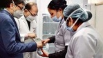 Medical professionals check vaccine vials at Kalawati Saran Children's Hospital Medical professionals check vaccine vials at Kalawati Saran Children's Hospital