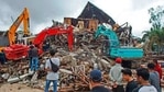 Rescuers search for survivors at the ruin of a local government building collapsed during an earthquake in Mamuju, West Sulawesi, Indonesia.(AP) Rescuers search for survivors at the ruin of a local government building collapsed during an earthquake in Mamuju, West Sulawesi, Indonesia.(AP)