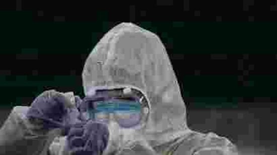A doctor prepares coronavirus testing for residents. A doctor prepares coronavirus testing for residents.