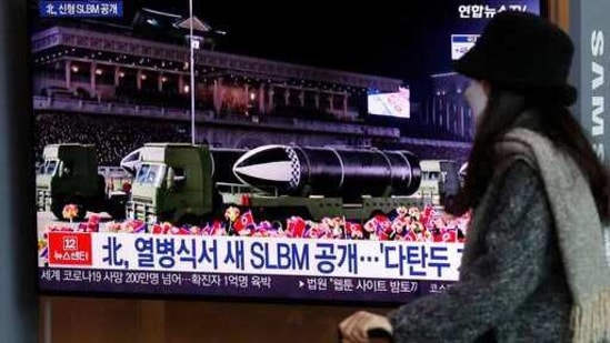 A woman wearing a face mask walks past in front of a TV screen showing a news program reporting about North Korea's military parade, at the Seoul Railway Station in Seoul, South Korea, Friday, Jan. 15, 2021. North Korea rolled out developmental ballistic missiles designed to be launched from submarines and other military hardware in a parade that punctuated leader Kim Jong Un's defiant calls to expand his nuclear weapons program. The part of letters read "North, new SLBM during a military parade." (AP Photo/Lee Jin-man)(AP) A woman wearing a face mask walks past in front of a TV screen showing a news program reporting about North Korea's military parade, at the Seoul Railway Station in Seoul, South Korea, Friday, Jan. 15, 2021. North Korea rolled out developmental ballistic missiles designed to be launched from submarines and other military hardware in a parade that punctuated leader Kim Jong Un's defiant calls to expand his nuclear weapons program. The part of letters read "North, new SLBM during a military parade." (AP Photo/Lee Jin-man)(AP)