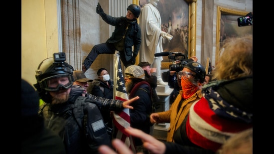 Pro-Trump protesters storm the Capitol Building, January 6. (REUTERS) Pro-Trump protesters storm the Capitol Building, January 6. (REUTERS)