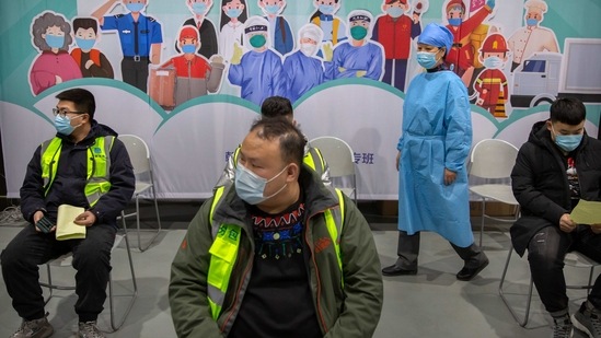 A medical worker wearing protective equipment monitors patients after they received the coronavirus vaccine at a vaccination facility in Beijing, Friday, Jan. 15, 2021. A city in northern China is building a 3,000-unit quarantine facility to deal with an anticipated overflow of patients as COVID-19 cases rise ahead of the Lunar New Year travel rush. (AP Photo/Mark Schiefelbein)(AP) A medical worker wearing protective equipment monitors patients after they received the coronavirus vaccine at a vaccination facility in Beijing, Friday, Jan. 15, 2021. A city in northern China is building a 3,000-unit quarantine facility to deal with an anticipated overflow of patients as COVID-19 cases rise ahead of the Lunar New Year travel rush. (AP Photo/Mark Schiefelbein)(AP)