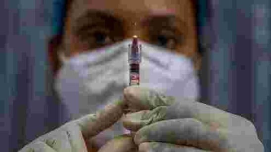 File photo: A health worker checks a syringe before performing a trial run of Covid-19 vaccine delivery system(AP) File photo: A health worker checks a syringe before performing a trial run of Covid-19 vaccine delivery system(AP)
