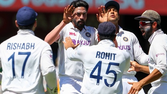 India's Mohammed Siraj, second left, celebrates with teammates after dismissing Australia's David Warner during play on the first day of the fourth cricket test between India and Australia at the Gabba, Brisbane, (AP) India's Mohammed Siraj, second left, celebrates with teammates after dismissing Australia's David Warner during play on the first day of the fourth cricket test between India and Australia at the Gabba, Brisbane, (AP)