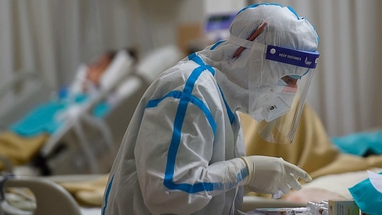 A medical staff works inside an intensive care unit for Covid-19 coronavirus patients at Max Hospital in New Delhi on November 21, 2020. (AFP) A medical staff works inside an intensive care unit for Covid-19 coronavirus patients at Max Hospital in New Delhi on November 21, 2020. (AFP)