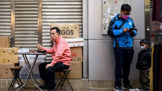 About 100 people have been arrested under the security legislation so far, with some activists saying their phones have been checked or confiscated by authorities.(AFP) About 100 people have been arrested under the security legislation so far, with some activists saying their phones have been checked or confiscated by authorities.(AFP)