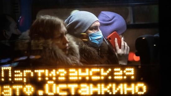 A woman wearing a face mask to help curb the spread of the coronavirus, rides a bus in Moscow, Russia, Thursday, Jan. 14, 2021. (AP) A woman wearing a face mask to help curb the spread of the coronavirus, rides a bus in Moscow, Russia, Thursday, Jan. 14, 2021. (AP)