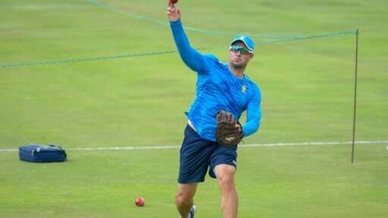 South African head coach Mark Boucher throws the ball during the pre-warmup on day two of the first cricket test match between South Africa and Sri Lanka at Super Sport Park Stadium in Pretoria, Sunday, Dec. 27, 2020. (AP Photo/Catherine Kotze)(AP)