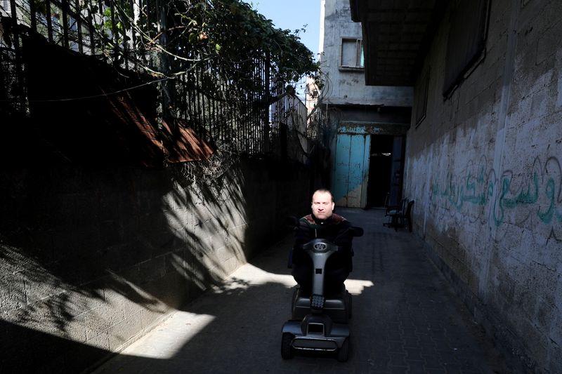 Youssef Abu Amira leaves his home in Gaza City. (REUTERS)