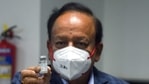Union health minister Harsh Vardhan shows a dose of Covaxin developed by Bharat Biotech at AIIMS in New Delhi on Saturday as the first phase of vaccination begins across the country. (ANI Photo) Union health minister Harsh Vardhan shows a dose of Covaxin developed by Bharat Biotech at AIIMS in New Delhi on Saturday as the first phase of vaccination begins across the country. (ANI Photo)