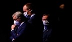 The three candidates as leader of the Christian Democratic Union (CDU) Friedrich Merz (C), Norbert Roettgen (L) and North Rhine-Westphalia's State Premier Armin Laschet stand behind the stage during the vote of the delegates on the second day of the Christian Democratic Union (CDU) party's 33rd congress held online because of the coronavirus pandemic, in Berlin(AFP) The three candidates as leader of the Christian Democratic Union (CDU) Friedrich Merz (C), Norbert Roettgen (L) and North Rhine-Westphalia's State Premier Armin Laschet stand behind the stage during the vote of the delegates on the second day of the Christian Democratic Union (CDU) party's 33rd congress held online because of the coronavirus pandemic, in Berlin(AFP)