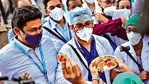 Employees welcome health workers carrying Covid vaccines at a hospital in Mumbai on Saturday.( Bloomberg) Employees welcome health workers carrying Covid vaccines at a hospital in Mumbai on Saturday.( Bloomberg)